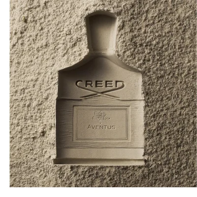 A photo shows three Creed perfume bottles, one dark liquid Aventus, one light liquid Aventus For Her, and one light liquid Aventus Cologne, with visible text including CREED, AVENUS, AVENUS FOR HER, AVENUS COLOGNE.